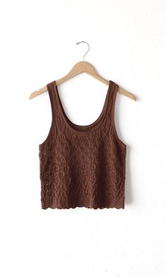 The crochet tank top features a scoop neckline. Pair with any bottoms or layer underneath your favorite outerwear. Tank top Crochet Scoop neck Self: 5100% Cotton Length: 19 1/2" Chest: 15 1/2" Hand wash in cold water. Lay flat to dry. Low iron. Model is wearing a size small Style #: G245WT6020 Luxury Fitted Brown Tank Top, Crochet Scoop Neck, Tank Top Crochet, Minimalist Wardrobe Essentials, Tops And Blouses, Crochet Tank Top, Crochet Crop, Sweater Jumpsuit, Crochet Tank