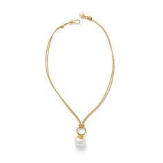 A low-key approach to the traditional pearl necklace. The Details: resilient cording (nylon + cotton blend) 18 x 16mm large, white pebble pearl, sits flat on neck pearl button + loop closure overall length 16-18”, adjustable polished 14 karat gold over brass We know you'll love your pieces, just in case, enjoy our two week return policy. Traditional Pearl Necklace, Pearl Drop Pendant, Triple Wrap Bracelet, White Pebbles, Gold Flecks, White Freshwater Pearl, Blue Quartz, Pearl Charms, Drop Pendant