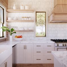 a kitchen with white cabinets and marble counter tops, along with open shelves on the wall