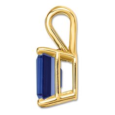 A mesmerizing rectangle-cut natural blue sapphire gemstone shimmers with distinction in this glamorous women's necklace pendant, fashioned in 14K yellow gold. Fine Jewelry Sapphire Rectangular Jewelry, Gold Sapphire Jewelry With Baguette Cut, Yellow Gold Sapphire Birthstone Necklace, Gold Baguette Cut Sapphire Jewelry, Sapphire Rectangular Pendant Jewelry For Gift, Classic Blue Rectangular Necklace, Sapphire Gemstone Jewelry With Rectangular Pendant, Elegant Sapphire Square Pendant Jewelry, Blue Gemstone Square Pendant Necklace