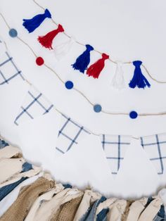 a white plate topped with blue and red tassels