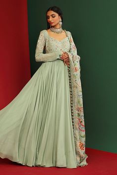 Jade long anarkali in  georgette base with floral embroidered bodice and sleeves. Comes with floral printed dupatta with hand made tassels.
Component: 2
Pattern: Printed, Embroidered
Type Of Work: Floral Pattern
Neckline: V-Neck
Sleeve Type: Full
Fabric: Georgette, Organza, Shantoon
Color: Green
Other Details: 
Circular tassel hem dupatta
Back plunged neck
Frayed lace hem neckline
Occasion: Wedding - Aza Fashions Maxi Length Georgette Churidar With Intricate Embroidery, Georgette Lehenga With Intricate Embroidery, Anarkali Georgette Gown With Zari Work, Fitted Anarkali Set With Intricate Embroidery In Georgette, Intricate Embroidery Georgette Lehenga, Anarkali Gown With Zari Work In Georgette, Intricate Embroidery Georgette Lehenga Maxi Length, Intricate Embroidered Georgette Lehenga Maxi, Floor-length Georgette Sharara With Intricate Embroidery