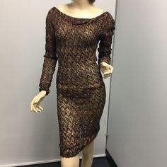 Beautiful Print Dress In Brown And Black Metallic , Cowl Neck. On And Off Shoulders. Brown Knee-length Midi Dress For Parties, Fitted Brown Midi Dress For Party, Brown Knee-length Party Dress, Brown Midi Party Dress, Brown Long Sleeve Mini Dress For Evening, Brown Midi Length Party Dress, Elegant Brown Midi Dress For Night Out, Brown Sheath Midi Dress For Party, Brown Long Sleeve Midi Dress For Party