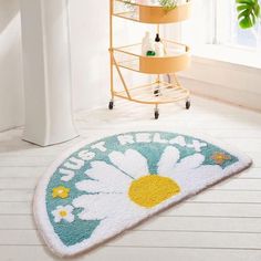 a bathroom with a rug that says just married and daisies on the floor next to it