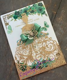 a birthday card with a gold and green dress