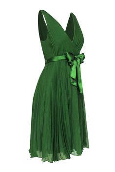 You will surely look as beautiful as a precious stone in this lovely emerald green mini dress from Rebecca Taylor. The pleated chiffon offers soft and floaty movement when you are wearing it. The soft fabric and movement will have you wearing this piece with elegance and delicacy. Pair with a matching emerald heel for any of your upcoming dressy events. Size 6 Shell & Lining: 100% Silk Concealed side zipper Fully lined A-line silhouette Surplice V-neckline Pleated detail Satin waist belt Bust 33 Chic Green A-line Chiffon Dress, Elegant Chiffon A-line Pleated Dress, Elegant Green Pleated Mini Dress, Elegant A-line Chiffon Pleated Dress, Elegant Flowy Pleated Chiffon Dress, Green Flowy A-line Chiffon Dress, Green Formal Dress With Pleated Bodice, Formal Green Dress With Pleated Bodice, Green Chiffon Evening Dress For Summer