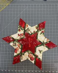 a quilted christmas star on a cutting board