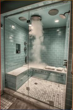 a steam bath in the middle of a tiled bathroom