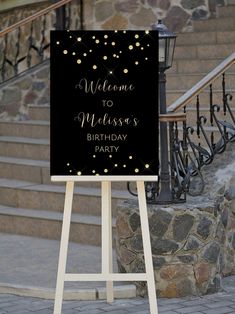 a welcome sign stands in front of some steps and railings, with the words welcome to meassasy's birthday party written on it