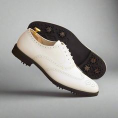 Also known as a wingtip, the Full Brogue is easily identifiable as one of the most classic pairs of men's dress shoes on the market. Featuring a brogue pattern along the sides as well as the toe cap, every man needs a Full Brogue in his shoe closet. The Details: Materials: white box calf Lining: beige calf leather Sole: GOLF Last: Zurigo - Rounded toe for fraditional English Look The Fine Print: Shoe production timeline/shipping can vary from 15-30 days from the date of order. All shoes are hand Men's Dress Shoes, The Fine Print, Fine Print, White Box, Shoe Closet, Golfers, Every Man, Golf Shoes, White Shoes