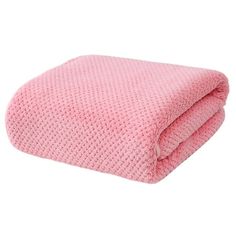 a pink blanket folded on top of each other