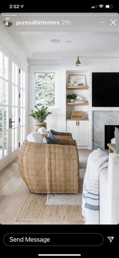 a living room filled with furniture and a flat screen tv mounted on the wall above a fireplace