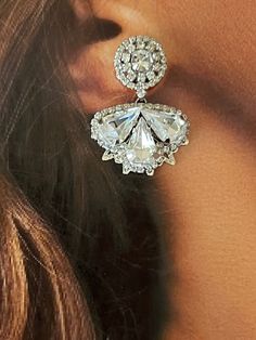 Our LEXES earrings are absolutely gorgeous and timeless to wear for a classic look. The silhouette consists of a a bigger floral design filled with crystals shaped in a leaf form to add a fine look. These will add a touch of sparkle to a stylish look. Handcrafted Highest Quality Swarovski / Cubic Zirconia Platinum plated Guards against scratches and tarnish. approximate size 1.15" length 1" width Nickel free Free Shipping in USA