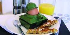 a breakfast plate with an egg in the shape of a tank