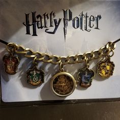 a harry potter bracelet with charms on it