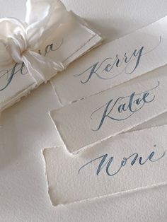 four pieces of white paper with blue ink on them that say fancy kate moie