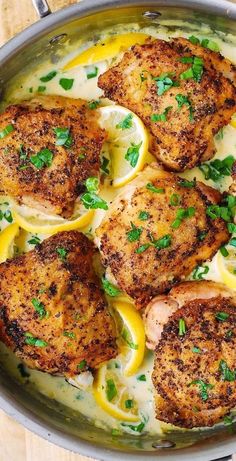 chicken with lemon sauce and parsley in a skillet