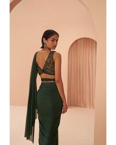 Indian Green Saree - Parul Gandhi Exuding stunning elegance, this pre-draped saree features a sleek design, adorned with tonal leaf motif embroidery on the blouse and belt. The intricate detailing adds a touch of sophistication, creating a seamless blend of modern style and traditional charm. Step into grace and glamour with this sleek pre-draped saree ensemble, where every element contributes to its breathtaking allure. Included in Purchase: Saree & Blouse Product Specification Color: Bottle Gr Elegant Draped Green Lehenga, Elegant Draped Choli With Draped Sleeves, Elegant Green Draped Blouse Piece, Formal Draped Choli With Unstitched Blouse, Elegant Fitted Blouse With Draped Sleeves, Fitted Pre-draped Party Wear Saree, Elegant Designer Choli With Draped Sleeves, Designer Pre-draped Fitted Saree, Green Fitted Saree For Evening