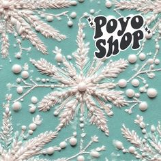 a blue and white snowflake pattern with the words poyo shop on it