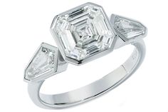 a diamond ring with three diamonds on it