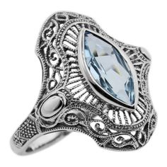 This Victorian style blue topaz filigree ring is handcrafted and finished in intricate sterling silver detail it features a beautiful 1 1/2 carat Marquise cut gemstone. Filigree rings are timeless in style and can be enjoyed, cherished and handed down as precious family heirlooms. In ancient times blue topaz was believed to assure beauty, fidelity and long life. It is the birthstone for the month of November. The blue topaz has also been designated as the 4th wedding anniversary stone. The ring Silver Blue Topaz Ring With Diamond Cut, Vintage Silver Topaz Ring With Diamond Cut, Art Deco Silver Topaz Ring With Center Stone, Silver Art Deco Topaz Ring With Center Stone, Elegant Silver Filigree Ring With Blue Topaz, Victorian Silver Blue Topaz Ring, Classic Filigree Blue Topaz Rings, Victorian Style Silver Ring With Blue Topaz, Victorian Blue Topaz Ring In Silver