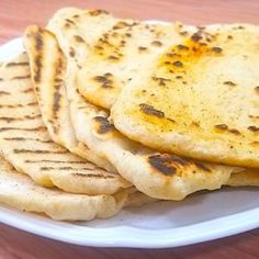 there are some pita bread on the plate