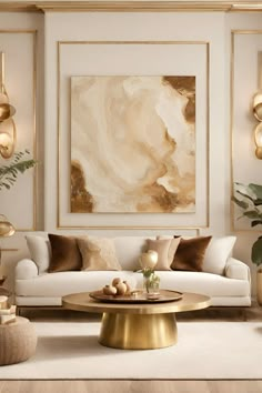 a living room with white couches, gold accents and large painting on the wall