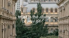 the words trust in the things you can't live by are surrounded by tall buildings