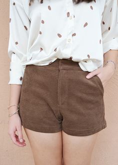 These high-waisted shorts feature a corduroy material with two side pockets and two faux back pockets. Annaclaire is wearing a Small. THIS ITEM IS A FINAL SALE. Corduroy Bottoms With Built-in Shorts, Trendy Corduroy Shorts, Trendy High Waist Corduroy Shorts, Trendy High-waisted Corduroy Shorts, Brown Shorts With Pockets For Fall, Chic Corduroy Bottoms With Pockets, Brown High-waisted Corduroy Shorts, Brown High Waist Corduroy Shorts, Spring High-waisted Corduroy Shorts