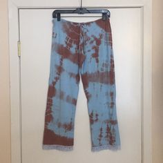 This Is A Brand New Love Tanjane Pair Of Pajama Bottoms. Blue And Brown Tie Dye With Blue Lace Trim. Draw String Waist. Made Of A Soft And Stretchy Material. Measures 17 Inches Across The Waist And Is About 26 Inches In Inseam Length. Made In Southern California And Hand Dyed. Price Is Firm. Thanks For Looking. Casual Sleepwear With Lace Trim For Loungewear, Casual Sleepwear With Lace Trim For Lounging, Bohemian Brown Pants For Loungewear, Bohemian Style Brown Bottoms For Loungewear, Casual Blue Sleepwear With Lace Trim, Bohemian Style Brown Loungewear Bottoms, Casual Cotton Pants With Lace Trim, Casual Blue Lace-trim Sleepwear, Bohemian Sleepwear With Lace Trim For Loungewear