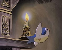 a bird flying next to a lit candle on top of a mantle