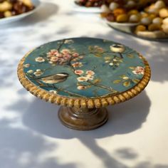 a table topped with plates and bowls filled with food on top of it's sides