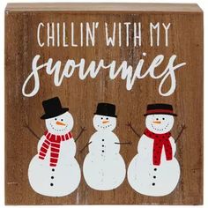 a wooden sign that says chillin'with my snowmen and two snowmen wearing hats