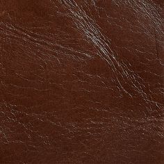 brown leather textured with white lines and scratches on the top part of the image