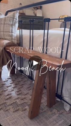 a wooden bench sitting in front of a bed