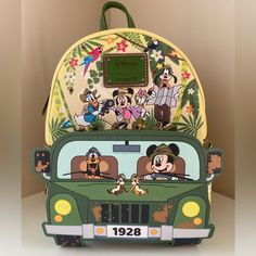 a backpack with mickey mouse and friends on it