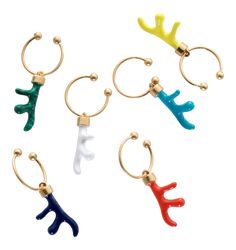 four different colored reindeer antlers are hanging from hoop earrings with gold hooks on each ear