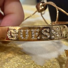 Nwt Guess Gold Tone Cuff Bracelet With Rhinestones & Slide Closure With Pretty Charms. One Charm Is A Triangle With White Rhinestones & The Other Is A Gold “G”. Slides Easy. Very Shiny. Doesn’t Look Tarnished At All To Me. See Pics For Details As Part Of The Description. If You Want The Earrings In The Bundle We Can Bundle Them For A Nicer Discount & Get More For Your Shipping. Any Questions Let Me Know Chunky Charm Bracelet, Shiny Bracelets, Rhinestone Slides, Guess Jewelry, Hook Bracelet, Gold Charm Bracelet, Bangles Style, Silver Chain Bracelet, Hinged Bracelet