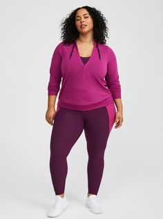 FIT Model is 5'11” wearing size 1. . Measures 28” from shoulder (size 2). . MATERIALS + CARE Lightweight French Terry knit fabric: Perfect for all seasons, this lightweight fabric is super versatile and totally soft. Stretch level: Maximum. . 67% polyester, 29% rayon, 4% spandex. Machine wash cold. Tumble dry low. . Imported. DETAILS Hooded neckline with drawstring. . Long sleeves. . Surplice bodice. Ribbed trim. . The best plus size women's french terry surplice long sleeve active hoodie hoodie Heather Stretch Tops For Fall, Hooded Tops For Fall Workout, Heather Athleisure Top For Fall, Versatile Cotton Activewear For Fall, Workout Top With Drawstring Hood, Sporty Heather Tops For Fall, Purple Long Sleeve Activewear For Spring, Purple Drawstring Hood Top For Fall, Athleisure Tops With Drawstring Hood For Layering