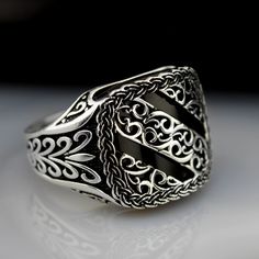 Silver,and black zirconium stones come together and are Decently designed for you in skillful hands. Designed in an oval shape, it reveals a different posture.We were inspired by the examples of Ancient Greece and the Ottoman Empire. - Metal : 925 Sterling Silver - Weight : 11.20gr - Made To Order - 925 Sterling Silver  - Your Ring Comes İn Our Special Box Luxury Silver Rings With Classic Design, Elegant Formal Signet Ring Stamped 925, Classic Sterling Silver Signet Ring With Intricate Design, Luxury Silver Signet Ring With Intricate Design, Luxury Men's Sterling Silver Ring With Intricate Design, Luxury Antique Men's Collectible Ring, Luxury Silver Men's Ring With Spiritual Style, Luxury Gothic Men's Ring In Sterling Silver, Ottoman Ring Men