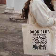 a woman carrying a book club tote bag