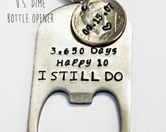 a bottle opener with a penny on it and the words happy 10 i still do