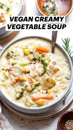 creamy vegetable soup in a white bowl with spoons and sprigs on the side