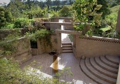 an outdoor area with steps and plants growing on the walls