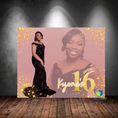 a woman standing in front of a large poster with the number sixteen on it's side