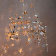 a chandelier with stars hanging from it