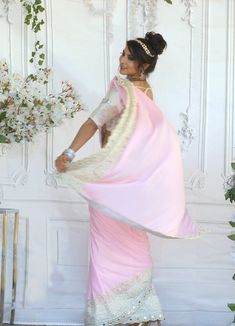 Since time immemorial, pink saree has been a perfect garment that has always reflected a woman’s beauty and elegance! This figure flattering Chiffon saree can be worn as a trendy saree. Fabric & Work Style -- Chiffon saree- Ivory Blouse has beautiful Embossed Print. Size 34-38 Details -- Assured quality.- Wash care instruction: Dry clean only.- Slight variation in color is possible due to digital photography. Elegant Pre-draped Saree For Navratri With Border, Pink Pre-draped Saree With Unstitched Blouse For Festivals, Bollywood Pre-draped Saree For Puja With Sheer Dupatta, Fitted Saree With Sheer Dupatta For Puja, Traditional Pre-draped Georgette Saree With Border, Pink Art Silk Pre-draped Saree For Party, Wedding Pre-draped Georgette Saree With Border, Fitted Pink Pre-draped Saree With Dupatta, Festive Pink Pre-draped Saree With Cutdana