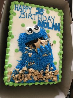 a birthday cake in the shape of a cookie monster