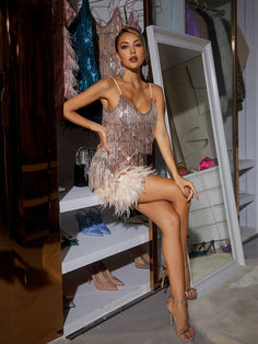 Austyn Tassel Feather Mini Dress In Champagne is destined to make herself known at the most extravagant parties. The ultimate show-stopping, party dress you will stand out wearing her. Adorned in pink fringing and sequins with flat beaded panelling on the waist to accentuate your curves and flatter your figure.   Individually hand embellished with champagne crystal waterfall fringe to create a mesmerising illusion when worn.     Material: 100% polyester    Invisible zipper opening at the back Feather Mini Dress, Jumpsuits And Romper, Sparkly Dress, Feather Dress, Maxi Dress Green, Embellished Dress, Shop Maxi Dresses, Prom Party Dresses, Wedding Party Dresses