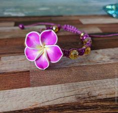 Adjustable Flower Beaded Bracelets For Beach, Beach Jewelry With Purple Sliding Knot, Beach Jewelry With Sliding Knot In Purple, Purple Jewelry With Sliding Knot For Beach, Adjustable Purple Braided Bracelets For The Beach, Pink Macrame Braided Bracelet For The Beach, Pink Macrame Bracelets For The Beach, Adjustable Flower Friendship Bracelets For Beach, Adjustable Pink Braided Bracelets For Beach